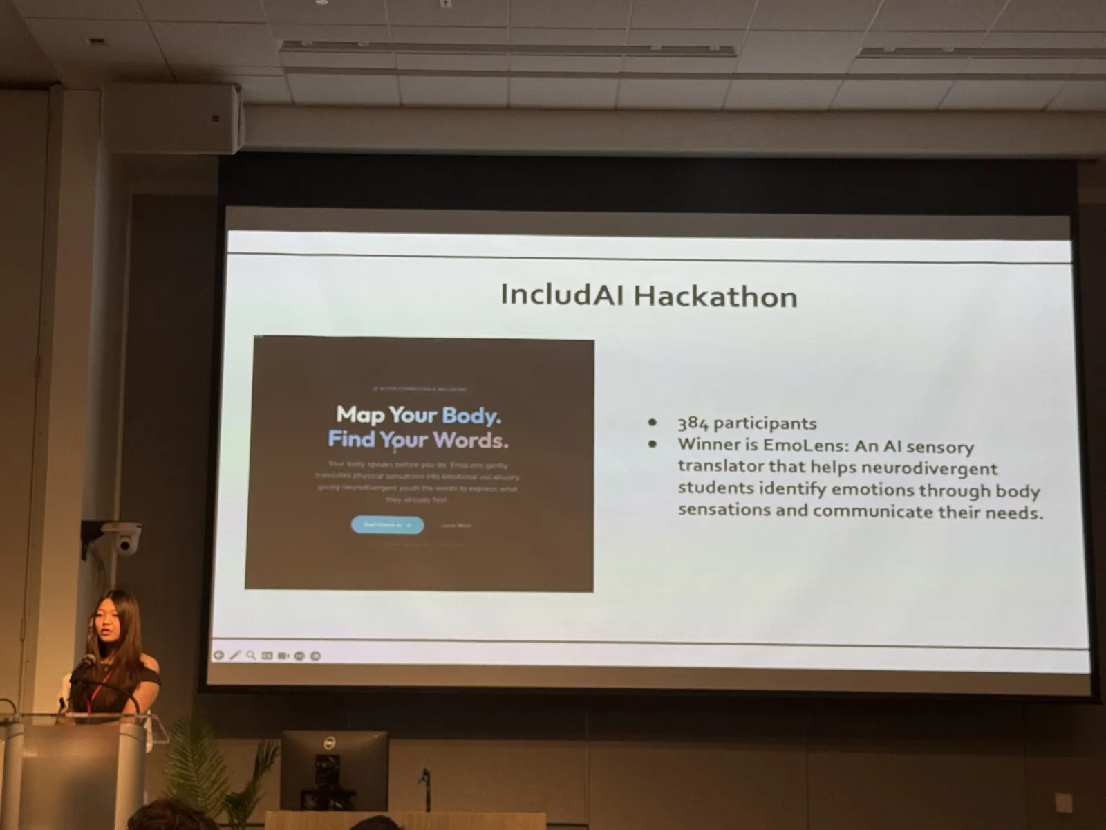 Isabella presenting the IncludAI Hackathon results on stage at the Stanford Neurodiversity Summit 2026