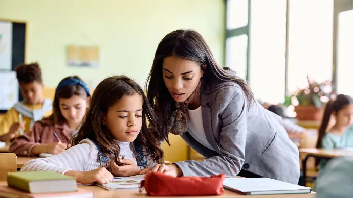 A teacher helping a student one-on-one